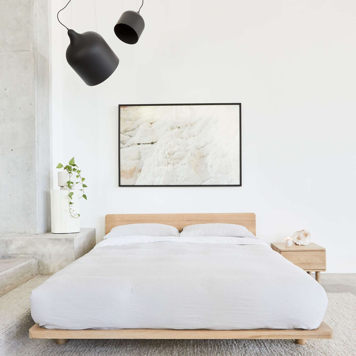 Lagos timber bed frame in solid oak, styled with white bedding and minimalist decor showing it&#39;s modern design - Totem Road